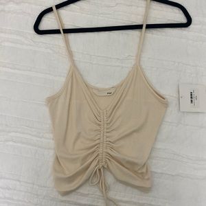 Cream colored crop tank.